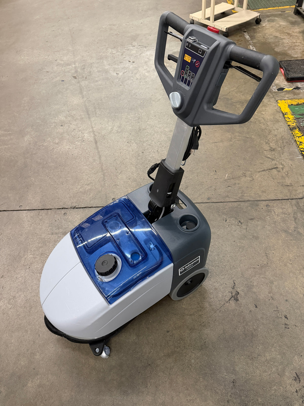 Compact floor scrubber